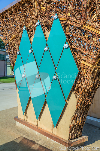 Image of Small solar panels for solar energy installed on a wall of public park pavillon, photovoltaic, alternative electricity source