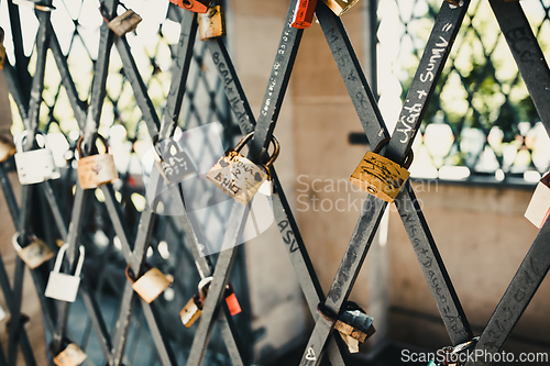 Image of Vintage locks in soft focus as a symbol of love for friends and lovers. Padlocks are attached to old tower