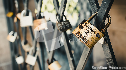 Image of Vintage locks in soft focus as a symbol of love for friends and lovers. Padlocks are attached to old tower