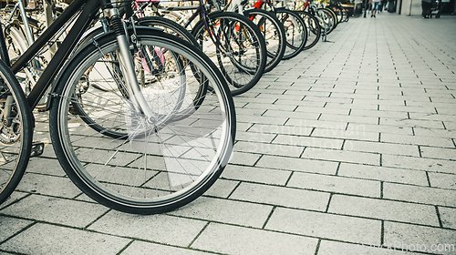 Image of Row of bikes parking on the street
