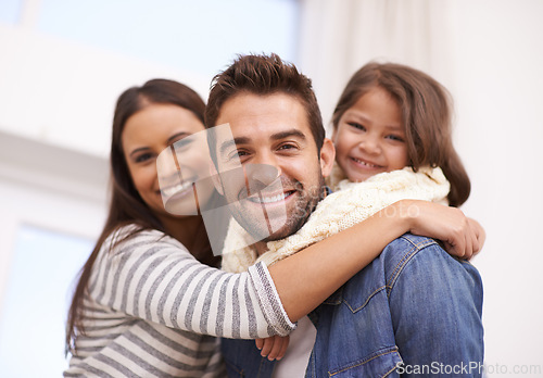 Image of Mom, dad and girl in home for portrait with love or care, quality time and family bonding for memories or connection. Parents, child and together for comfort or safety on weekend, hug and happiness.