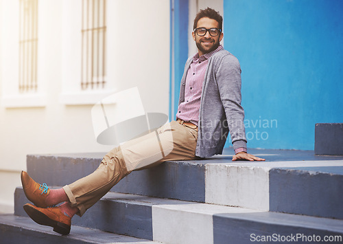 Image of Man, fashion and happiness in city with glasses, relax with black frame for style and chic outfit. Urban, unique and trendy designer clothes, spectacles for accessory and apparel with model outdoor