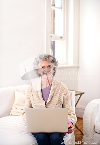 Image of Laptop, sofa and portrait of elderly woman in living room for movie, weekend and enjoyment. Relax, smile and senior person with digital technology for happiness, streaming and retirement at home