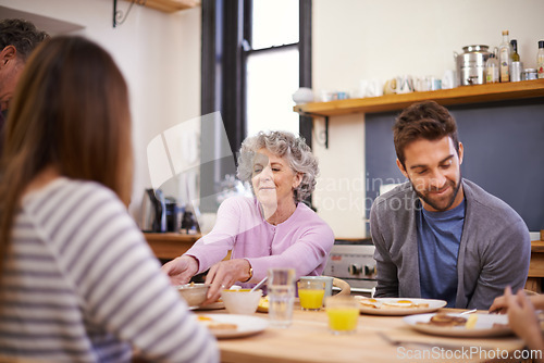 Image of Breakfast, family home and grandparents with kitchen table, nutrition and smile with love and weekend break. Apartment, food and senior people eating meal together with conversation, joy and wellness