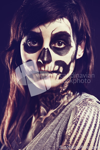 Image of Skull, makeup and portrait of woman in studio for festival, Halloween and day of the dead. Creative art, costume and person with face paint for horror, scary and gothic aesthetic on black background