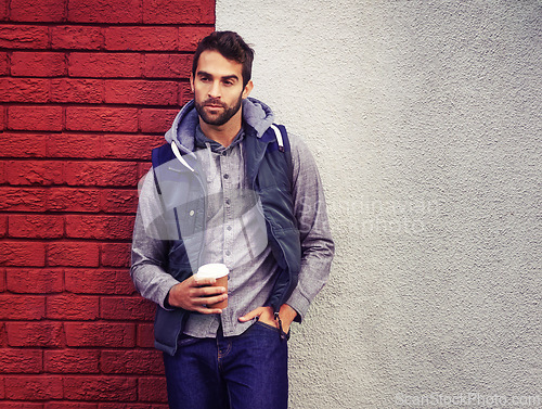 Image of Fashion, wall or man with Coffee thinking of casual clothes, style or edgy hoodie for winter outdoor outfit. Tea, cool model or stylish person in urban town in streetwear or trendy jacket in Italy