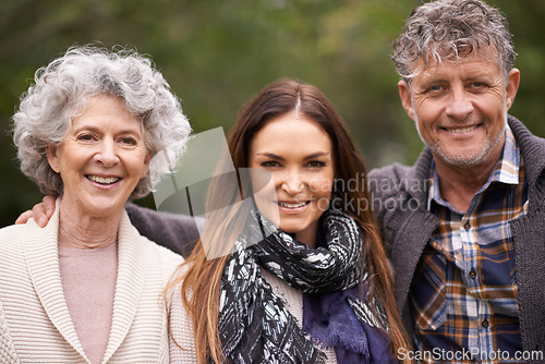 Image of Portrait, hug and senior parents with daughter, outdoor and happiness with nature and bonding together. Face, family or group with fresh air and embrace with smile and elderly mother with old father