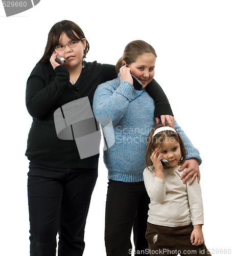 Image of Three Girls Talking On Cell Phones