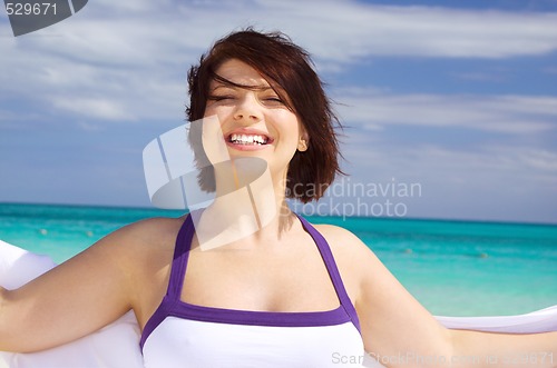 Image of happy woman with white sarong