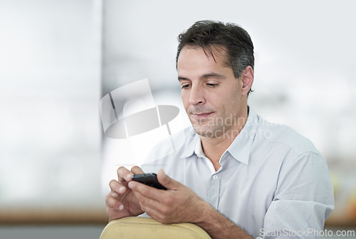 Image of Business man, schedule and typing on cellphone in office for communication, reading email or browsing internet. Corporate, smartphone and male person in workplace for social media, connection or chat