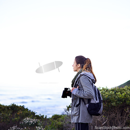 Image of Woman, mountain view and binoculars for nature trekking hike for holiday exercise, explore or journey. Female person, workout and walking on hikking path for healthy sport, backpacking or adventure