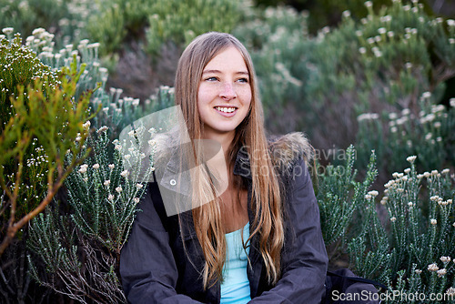 Image of Woman, hiking and flower environment for mountain exploring or adventure, trekking or view. Female person, plants and outdoor journey for holiday wellness or backpacking vacation, exercise or travel