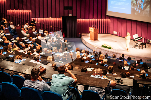 Image of Woman giving presentation on business conference event.