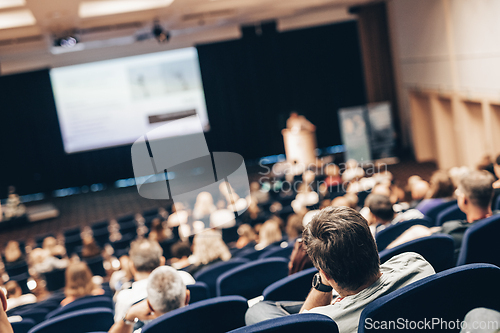 Image of Speaker giving a talk on scientific conference. Audience at the conference hall. Business and Entrepreneurship concept.
