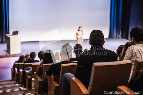 Image of Woman giving presentation on business conference event.