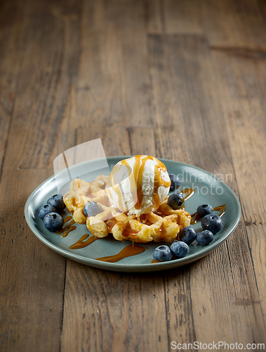 Image of plate of belgian waffle with vanilla ice cream