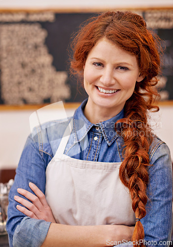 Image of Barista, woman and arms crossed in portrait at coffee shop with smile, pride and entrepreneurship. Person, waitress or small business owner at cafeteria with confidence for service, catering or job