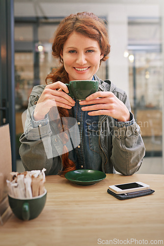 Image of Woman, cup and happy in coffee shop for portrait at breakfast to start morning at table. Girl, person and smile in cafeteria with flavor, aroma and relax in restaurant for catering service in Dublin