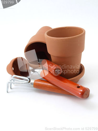 Image of Empty Orange Gardening Pots and Tools