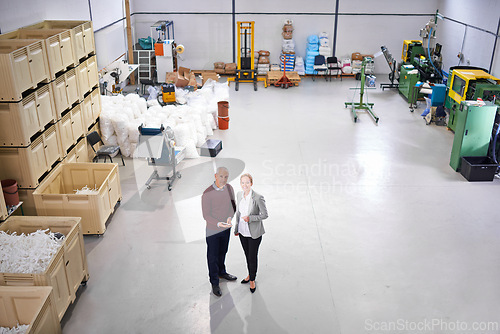 Image of Factory, warehouse and portrait of business people with tablet for logistics, training and management. Mature man, woman and partnership with tech for planning, teamwork or distribution from above