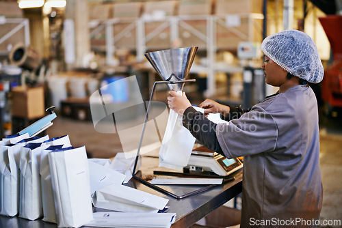 Image of Manufacturing, woman and coffee packaging in factory with export service, career and production process. Business, worker and employee with bags, weighing tool or supply chain industry in warehouse