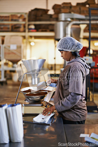 Image of Manufacturing, woman and coffee packaging in factory with export service, career and production process. Business, worker and employee with bags, weighing tool or supply chain industry in warehouse