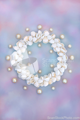 Image of Oyster Pearl and Cockleshell Sea Shell Wreath on Rainbow Sky