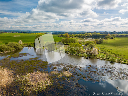 Image of Beautiful spring landscape with small pond.