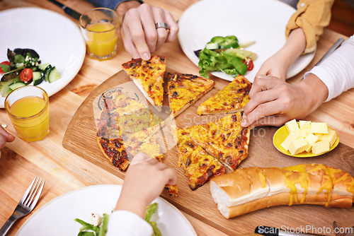 Image of Hands, pizza and top view of family eating food at table in home for lunch or hungry for bread. Margherita, group and people with mozzarella slice for dinner with salad on plate, cheese and closeup
