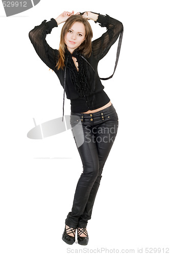 Image of Beautiful girl in black leather pants. Isolated