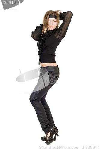 Image of Beautiful young woman in black leather pants. Isolated 