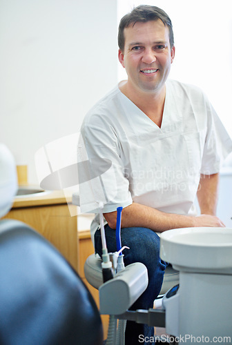 Image of Portrait, smile or man dentist in consulting office for help, advice or mouth wellness exam. Dental, oral care or orthodontist, doctor or specialist with friendly service, teeth whitening or hygiene