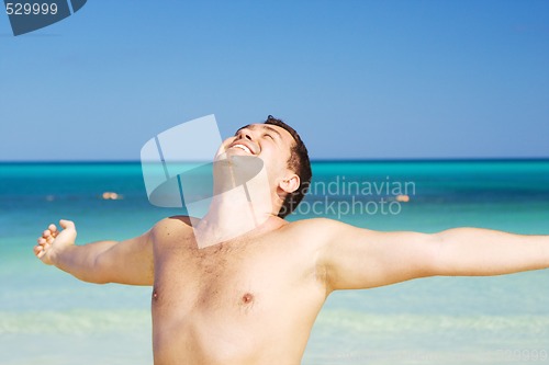 Image of happy man on the beach