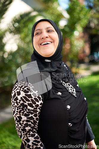 Image of Mature woman, muslim and smile in garden at home for eid or ramadan for religion to enjoy and satisfied. Faith, Islam and happy for faith or hope with fasting on outfit for mosque, salvation and pray