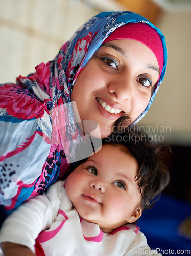 Image of Happy, baby and portrait of muslim mom in home with love and care for family in Saudi Arabia. Infant, child and Arabic mother relax in house with support and kindness for kid in embrace of mama