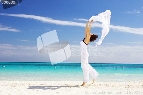 Image of happy woman with white sarong