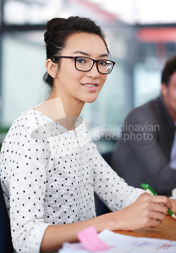 Image of Happy, portrait and creative woman at desk in office planning with notes for project or report. Professional, employee and person with productivity, writing process or work on development of idea