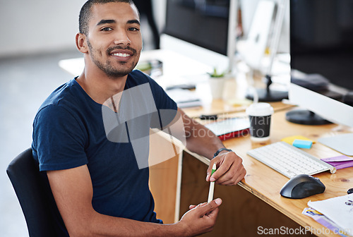 Image of Young man, portrait and planning on computer for creative project, research and online editing of website. Professional graphic designer, employee or business person working on desktop at a startup