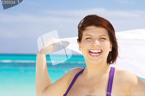 Image of happy woman with white sarong