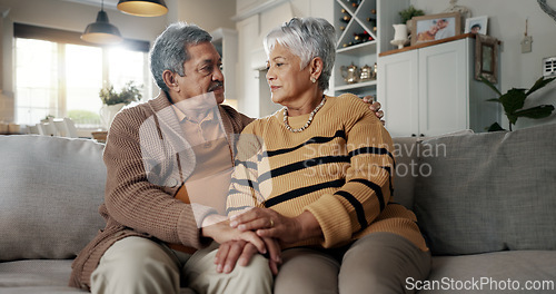 Image of Senior, couple and hug for empathy on sofa with support, grief and comfort in living room of house. Old people, man and woman with love and embrace for security, compassion and sympathy on couch