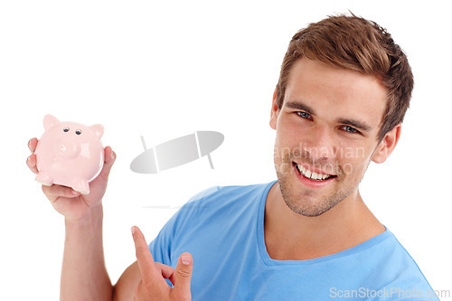 Image of Portrait, piggy bank and happy man pointing in studio for finance, budget or invest. Face, smile or person with money box for savings, income or security of future profit isolated on white background