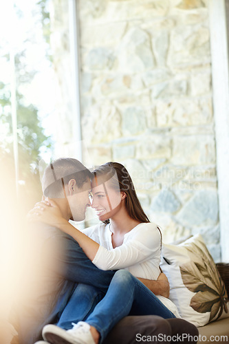 Image of Home, couple and forehead for romance, embrace and lap or care on couch in living room. Happy people, touch and smile for pride in relationship or commitment, loyalty and connection on hug date