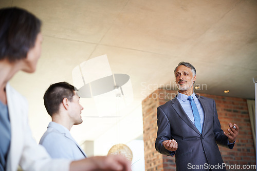 Image of Presentation, teamwork or senior businessman teaching advice tips for seminar or skill development in meeting. CEO, workshop or mature leader talking in mentorship, training or coaching for learning