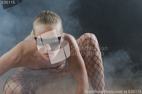 Image of Sexy girl in smoke filled room