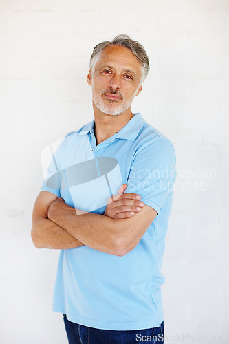 Image of Portrait, fashion and senior man with arms crossed, casual outfit and model on white studio background. Face, mature person and old guy with mockup space and trendy with stylish clothes or retirement