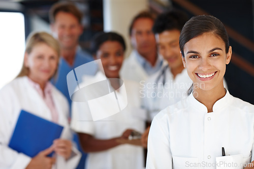 Image of Doctors, group and portrait with woman in hospital for diversity, medicine or colleagues for healthcare. Men, people and happy in team with medical staff for solidarity, pride or leadership in clinic