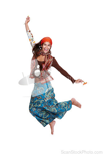 Image of Woman, fashion and portrait in studio with dress for gypsy, creativity and bohemian style for trend. Lady, model and jump for excited with skirt for aesthetic and clothes with pattern and colour