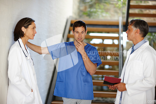 Image of Medical, team and conversation with thinking people, hospital nurse and doctor in discussion for patient result. Health, collaboration or consulting surgeon for help, healthcare idea or brainstorming