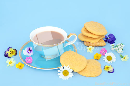 Image of English Afternoon Tea with Cookies Teacup and Flowers 