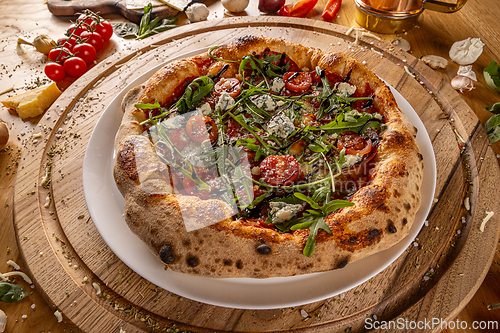 Image of Gourmet pizza topped with blue cheese